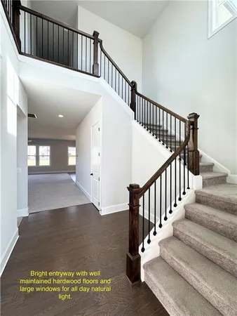 a view of staircase with white walls