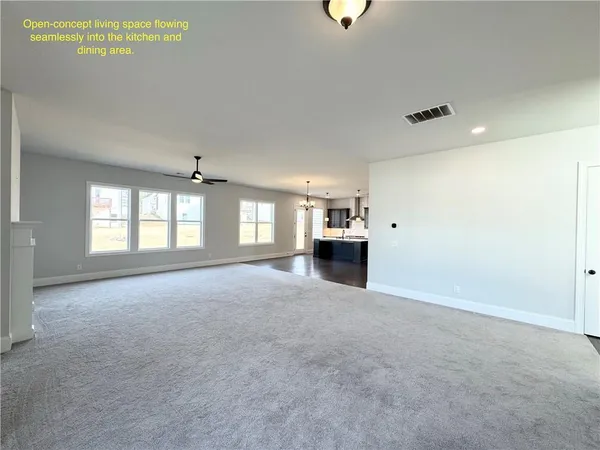 a view of empty room with a fireplace