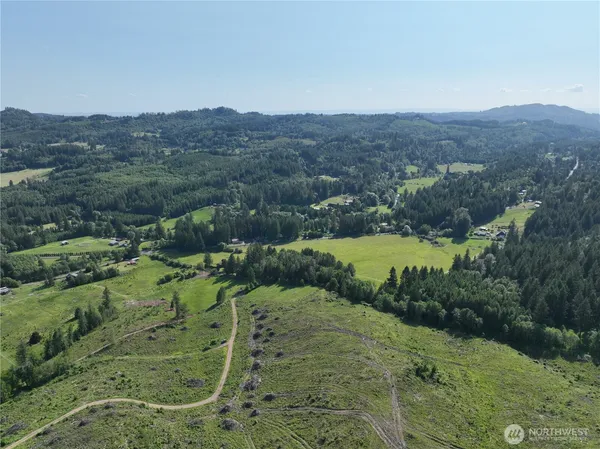 an aerial view of a house with mountain view