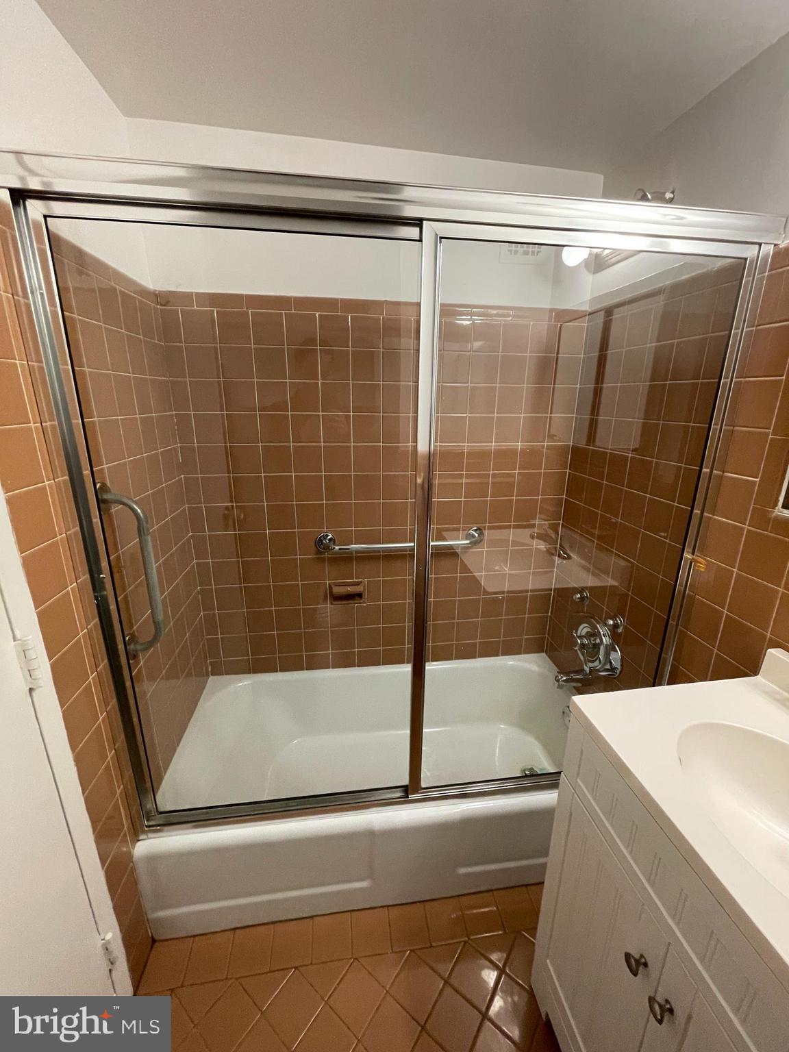 7900 Old York Road, Unit 311B Elkins Park, PA 19027 - Photo 12 of 22 a bathroom with a shower and a bathtub
