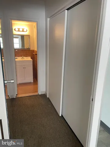 a view of a kitchen from the hallway