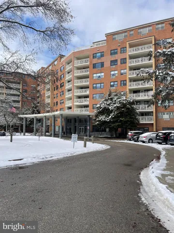 a front view of a building with a road