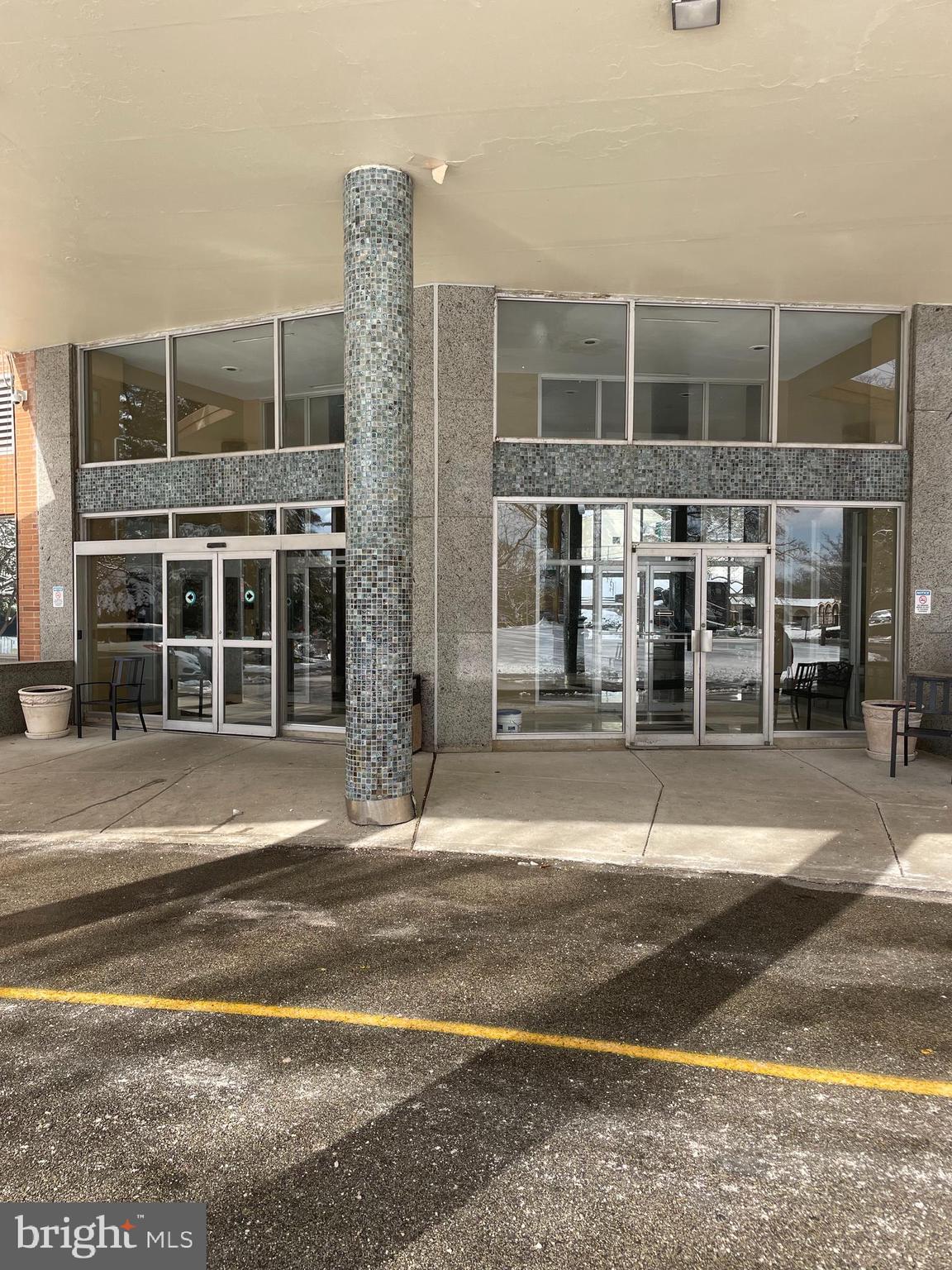 7900 Old York Road, Unit 311B Elkins Park, PA 19027 - Photo 3 of 22 a view of a brick building next to a yard