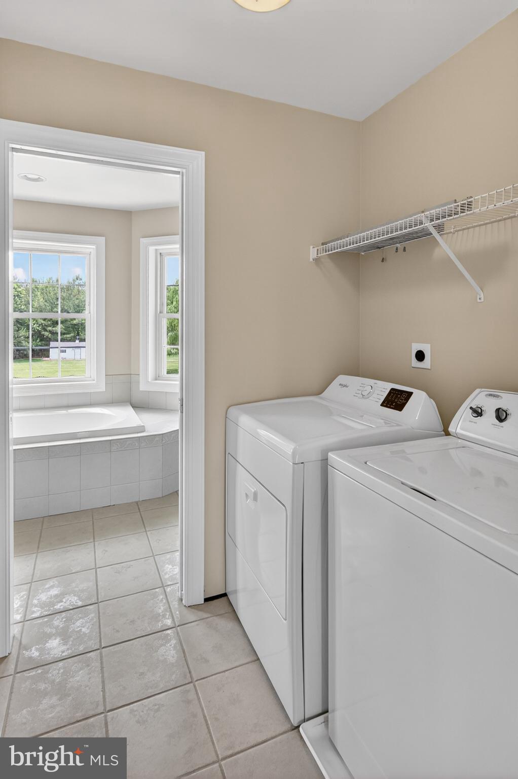 337 Roe Ingleside Road Centreville, MD 21617 - Photo 43 of 56 a utility room with dryer and washer