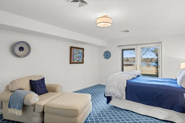 a bedroom with a bed and a table in it