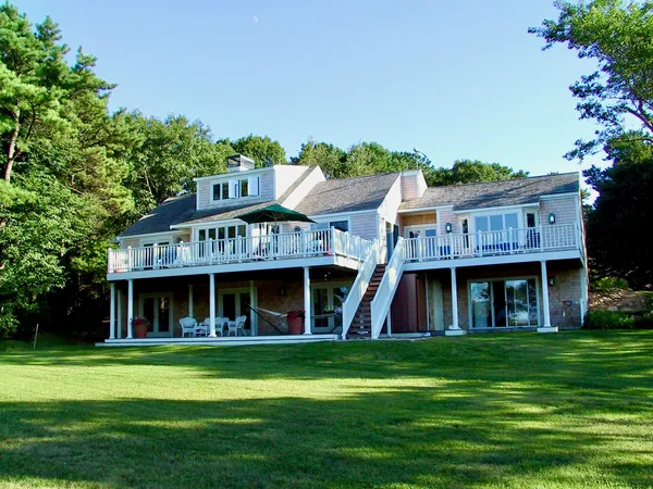 a front view of a house with a garden