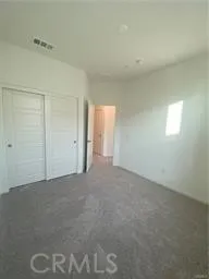 a view of an empty room and a window