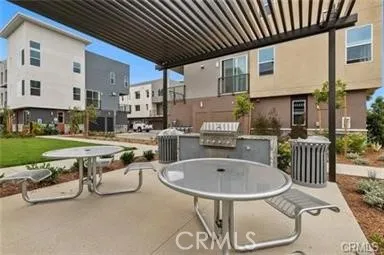 a dinning table and chairs in the patio