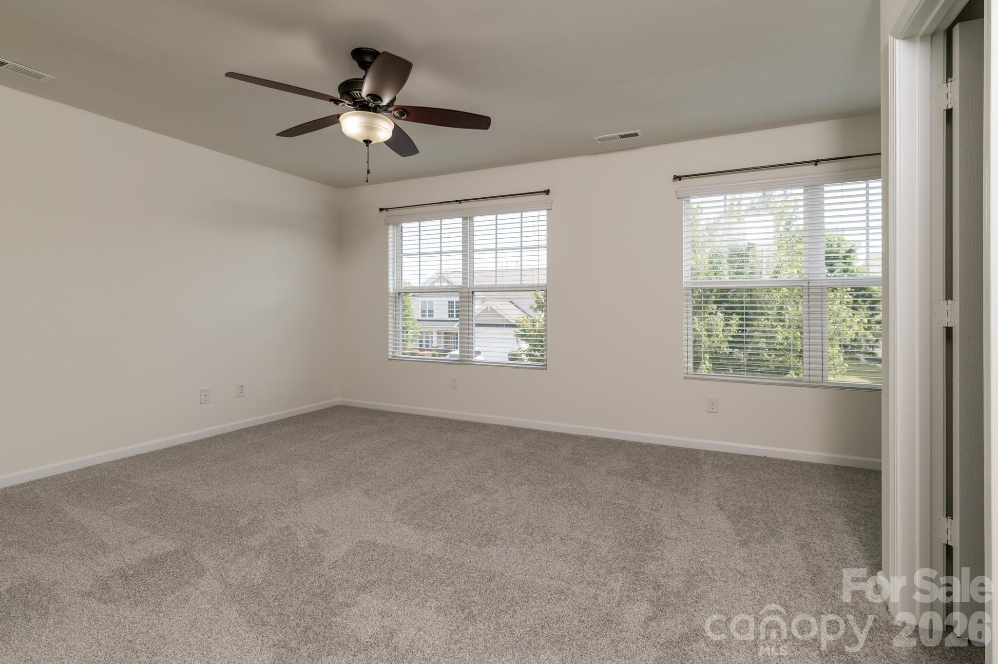 8212 Ruby Valley Road Charlotte, NC 28277 - Photo 31 of 40 a view of an empty room with a window