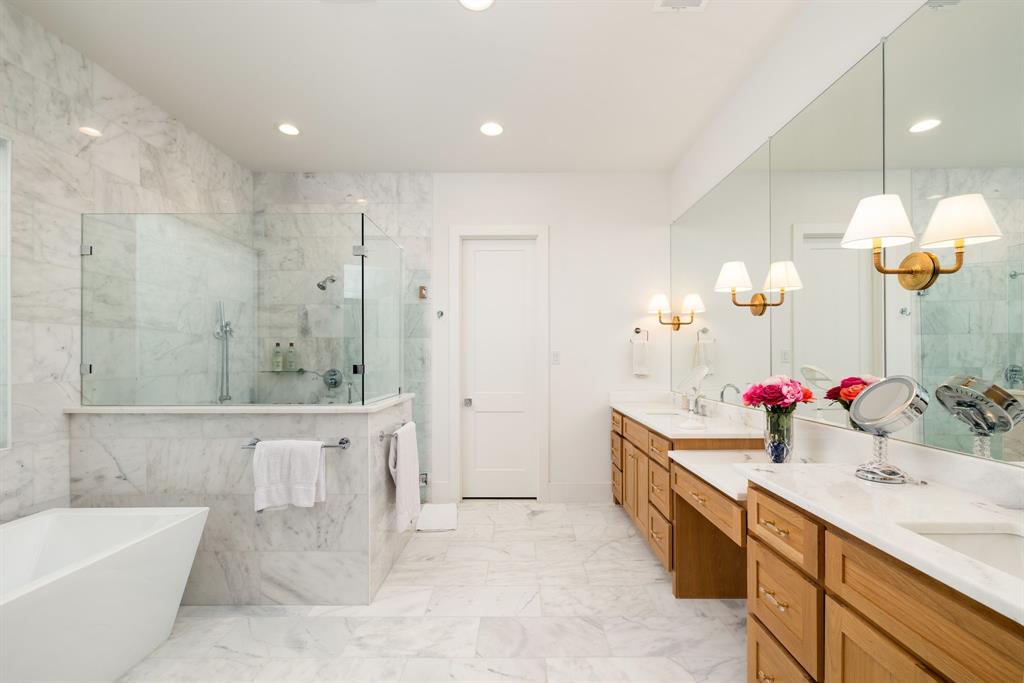 5019 Lark Lane Dallas, TX 75209 - Photo 13 of 32 a bathroom with a double vanity sink mirror and bathtub