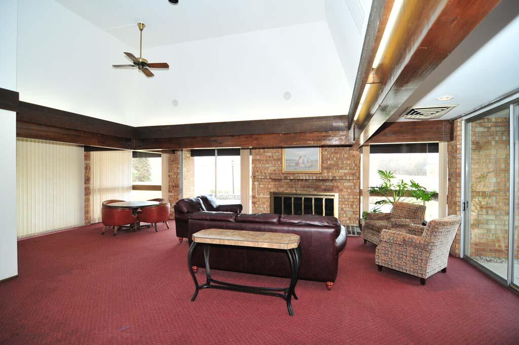 11907 West Appleton Avenue, Unit 20 Milwaukee, WI 53225 - Photo 39 of 44 Relax by the Fireplace