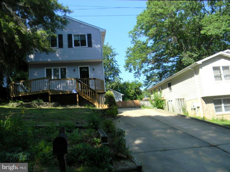 1735 Quantico Road Edgewater, MD 21037 - Photo 2 of 30 a front view of a house with a yard and green space