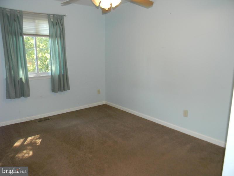 1735 Quantico Road Edgewater, MD 21037 - Photo 12 of 30 an empty room with a window