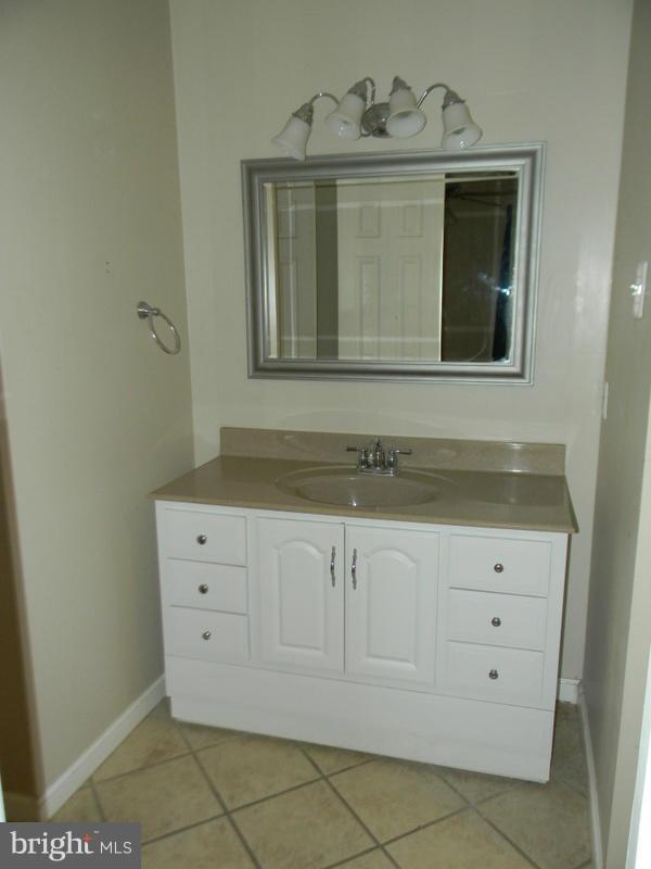 1735 Quantico Road Edgewater, MD 21037 - Photo 14 of 30 a bathroom with a mirror