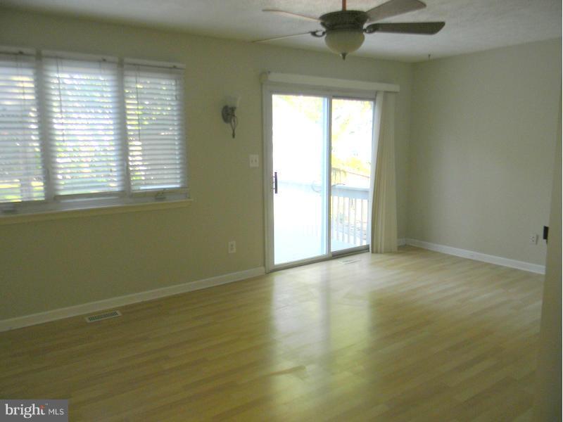1735 Quantico Road Edgewater, MD 21037 - Photo 3 of 30 a view of an empty room with a window