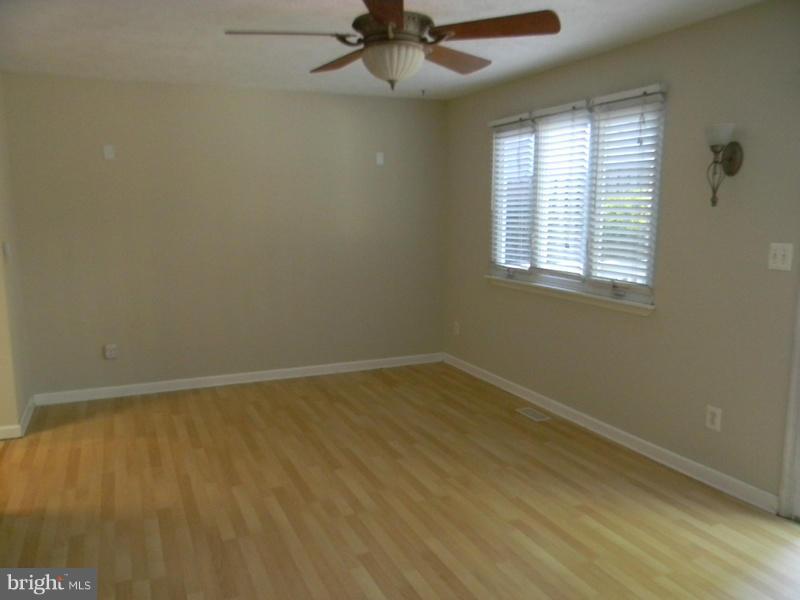 1735 Quantico Road Edgewater, MD 21037 - Photo 5 of 30 an empty room with a window and a fan