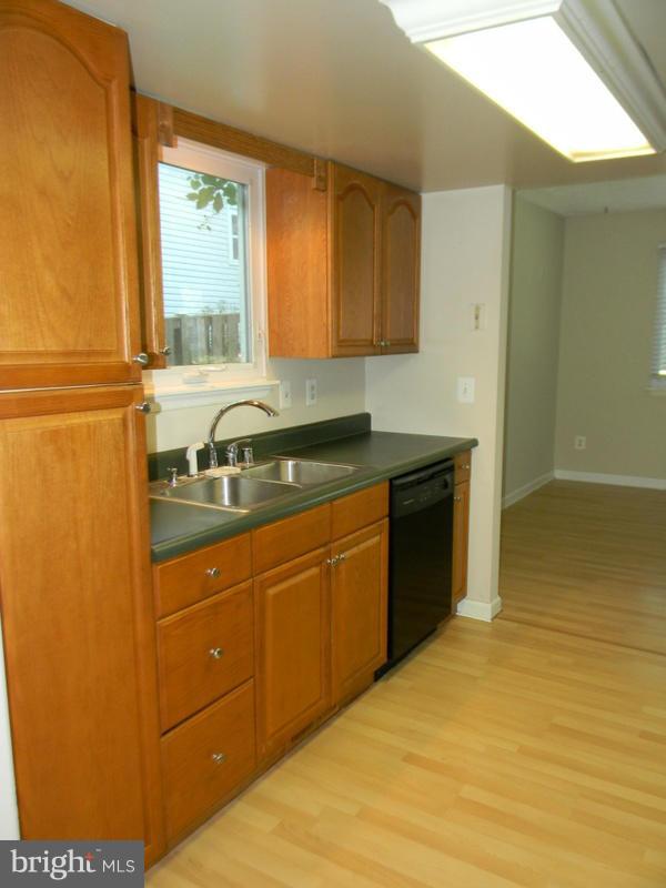 1735 Quantico Road Edgewater, MD 21037 - Photo 7 of 30 a kitchen with a sink and a window