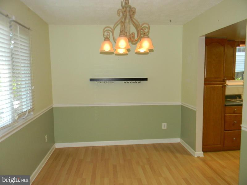 1735 Quantico Road Edgewater, MD 21037 - Photo 10 of 30 a view of a room with wooden floor and windows