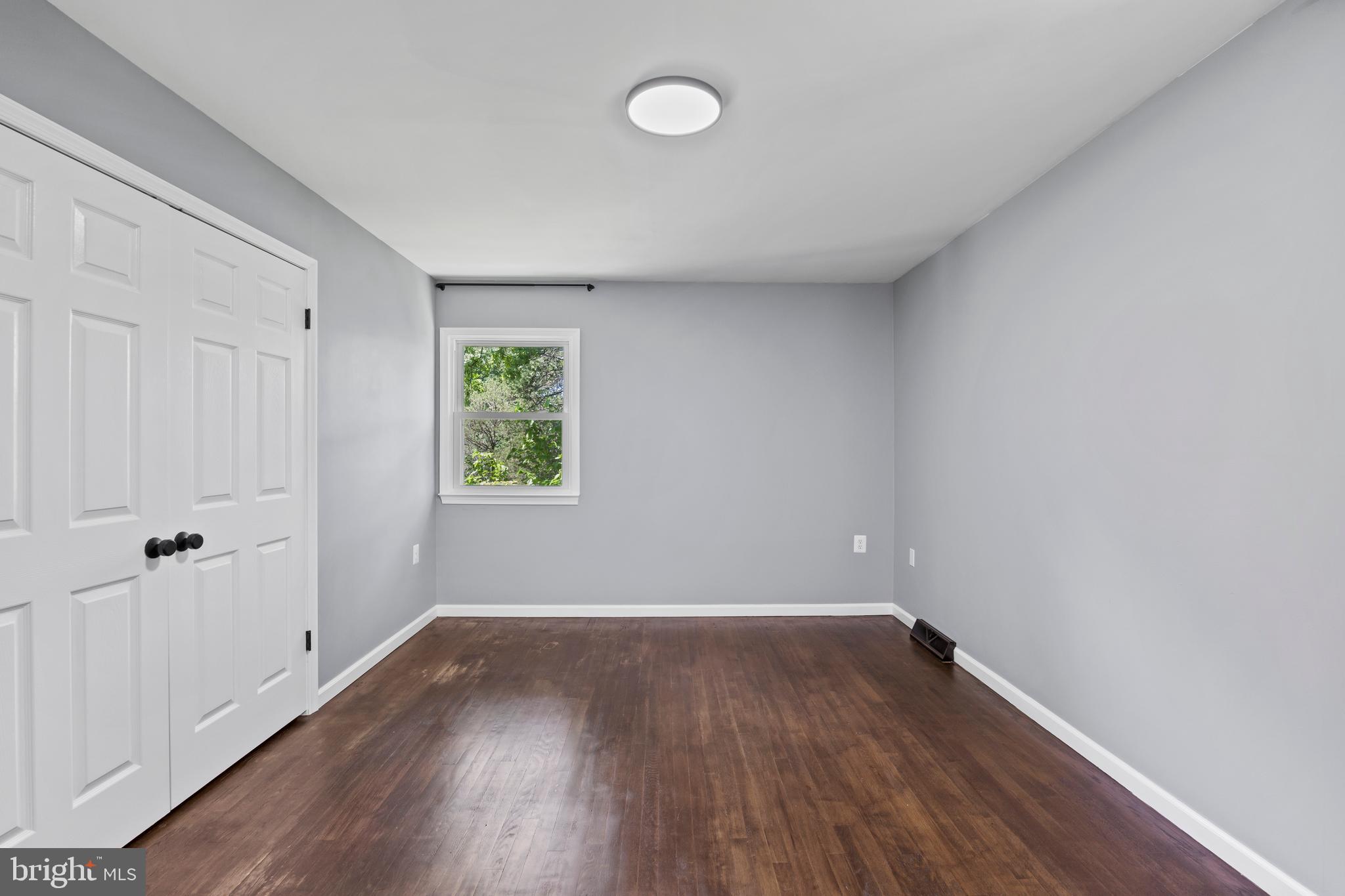 11019 Ring Road Reston, VA 20190 - Photo 40 of 78 a view of room with wooden floor and window
