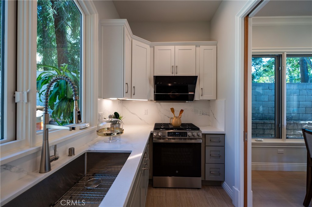 894 Fallen Leaf Road Arcadia, CA 91006 - Photo 9 of 28 a kitchen with a refrigerator and a sink