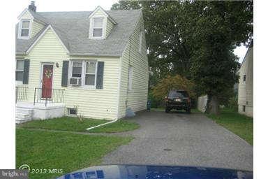 5630 Johnnycake Road Baltimore, MD 21207 - Photo 2 of 19 a view of a house with a yard