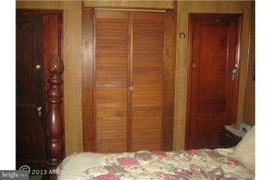 5630 Johnnycake Road Baltimore, MD 21207 - Photo 12 of 19 a bedroom with a door