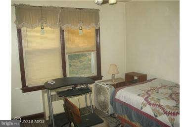 5630 Johnnycake Road Baltimore, MD 21207 - Photo 15 of 19 a bedroom with a bed and a window
