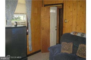 5630 Johnnycake Road Baltimore, MD 21207 - Photo 6 of 19 a living room with furniture and a window