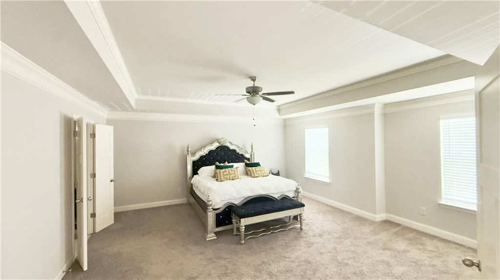 3370 Elkhorn Ridge Run Dacula, GA 30019 - Photo 18 of 29 a bedroom with a bed and a window