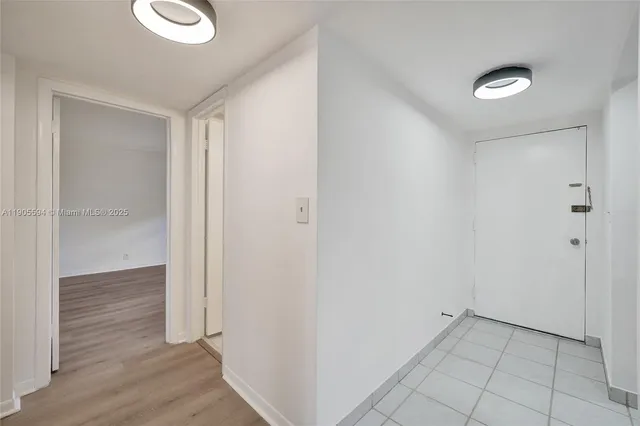 a view of a hallway with closet