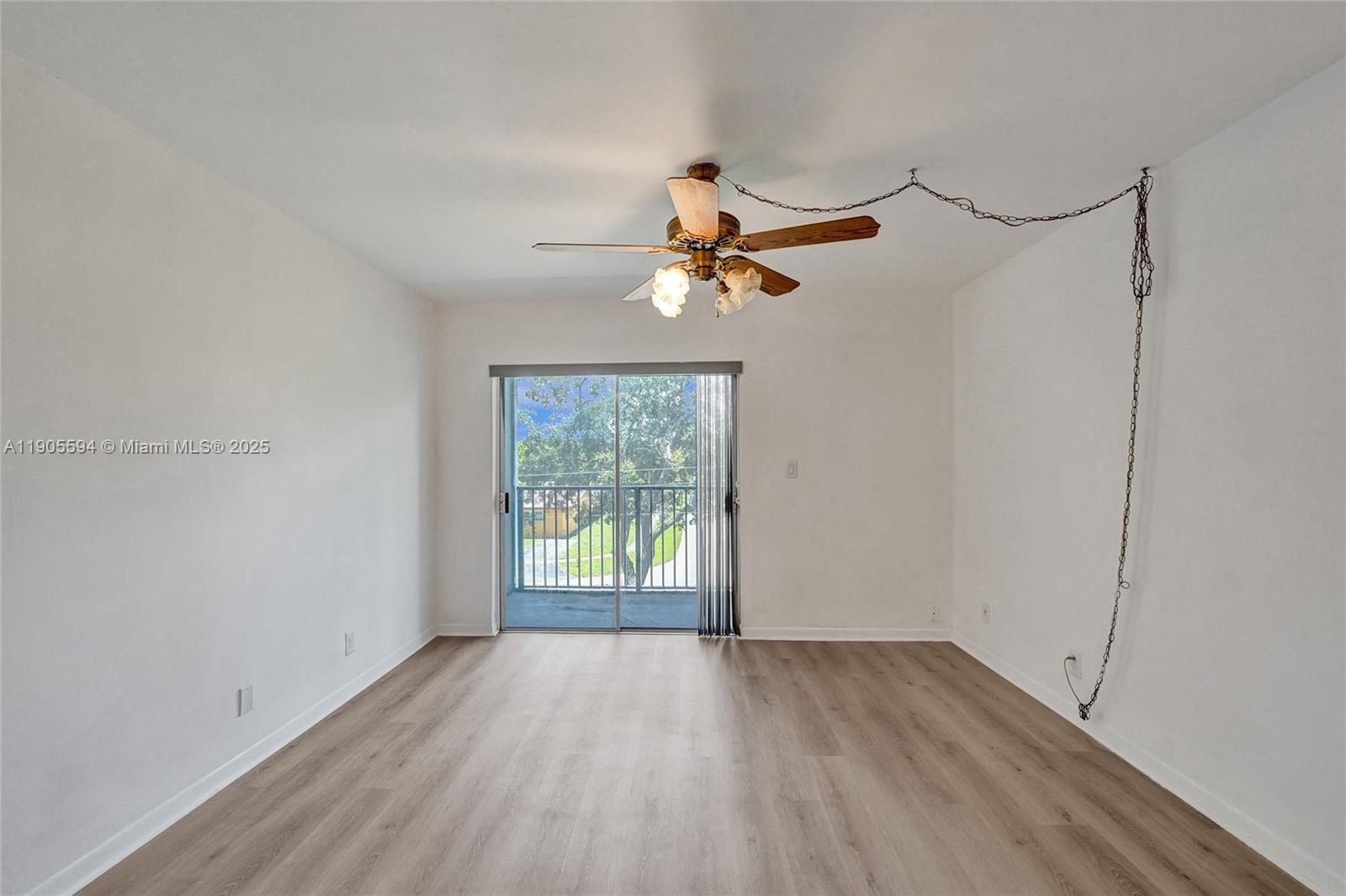 7541 Northwest 16th Street, Unit 1310 Plantation, FL 33313 - Photo 16 of 46 wooden floor in an empty room with a window