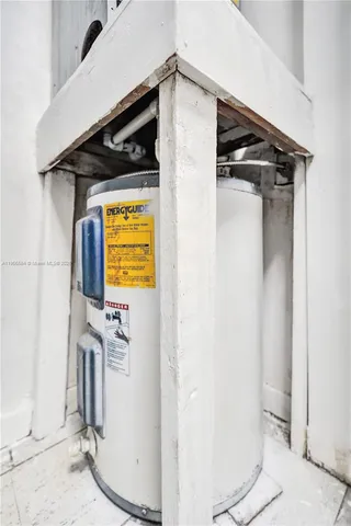 a bathroom with a granite countertop sink a toilet and a mirror