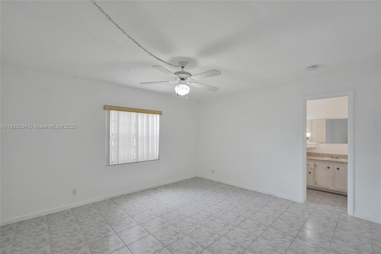 7541 Northwest 16th Street, Unit 1310 Plantation, FL 33313 - Photo 27 of 46 an empty room with a window and a bathroom