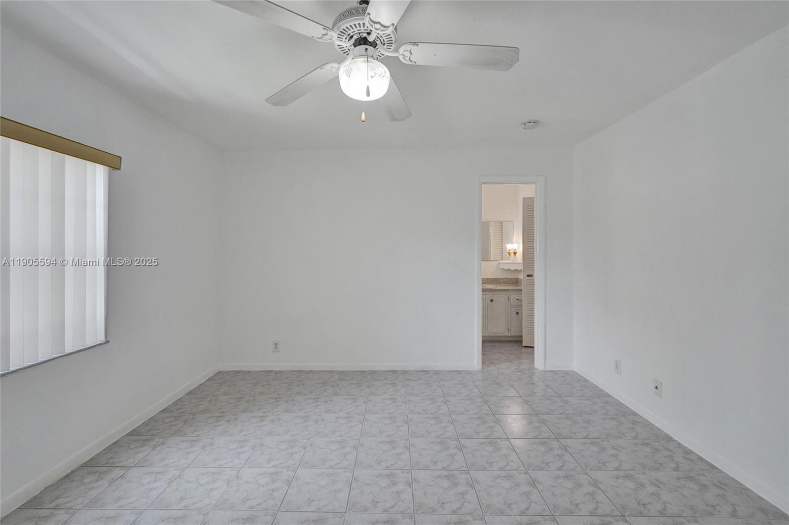 7541 Northwest 16th Street, Unit 1310 Plantation, FL 33313 - Photo 28 of 46 wooden floor in an empty room with a window