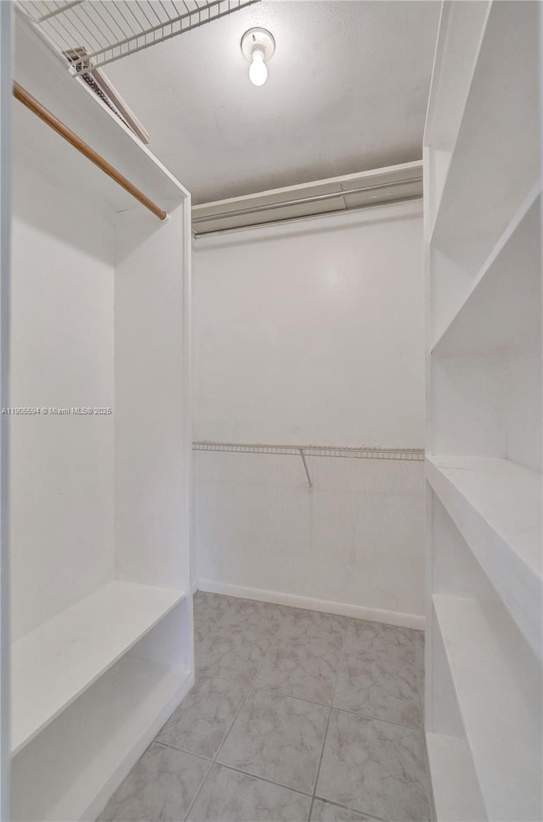 7541 Northwest 16th Street, Unit 1310 Plantation, FL 33313 - Photo 31 of 46 a view of an empty walk in closet