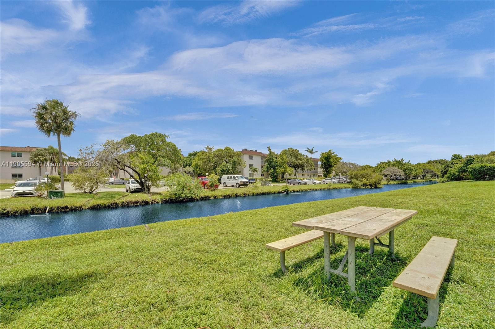 7541 Northwest 16th Street, Unit 1310 Plantation, FL 33313 - Photo 37 of 46 a view of a swimming pool and lounge chairs