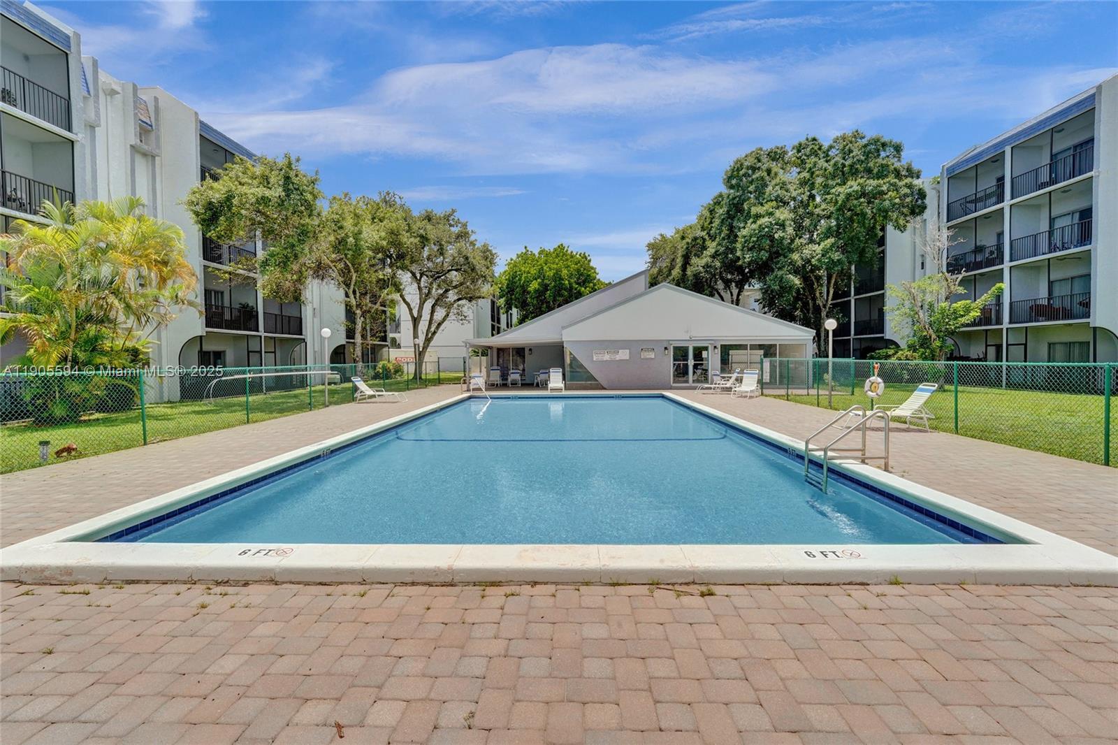 7541 Northwest 16th Street, Unit 1310 Plantation, FL 33313 - Photo 39 of 46 a view of house with a swimming pool