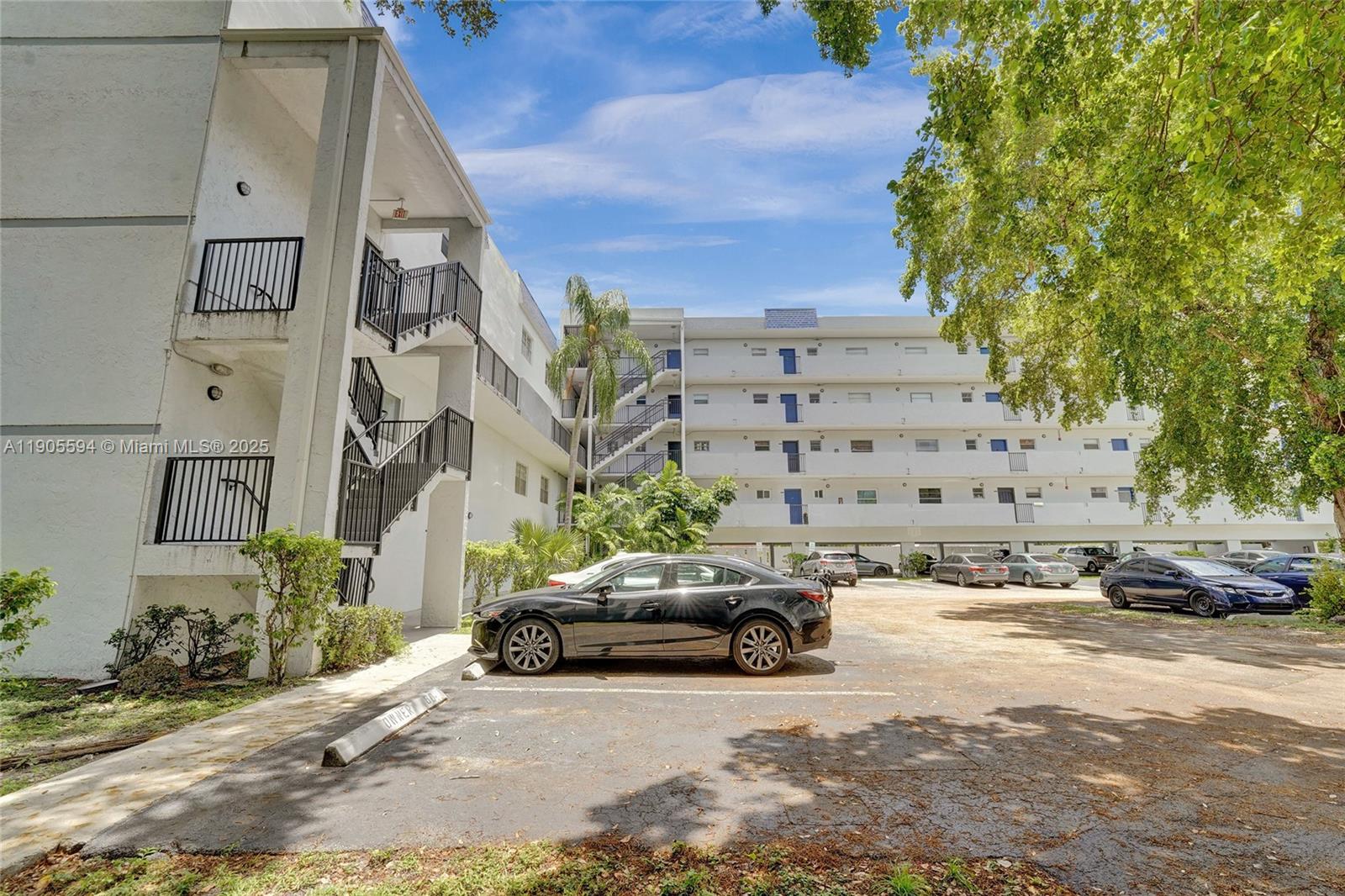 7541 Northwest 16th Street, Unit 1310 Plantation, FL 33313 - Photo 43 of 46 a view of street with parked cars