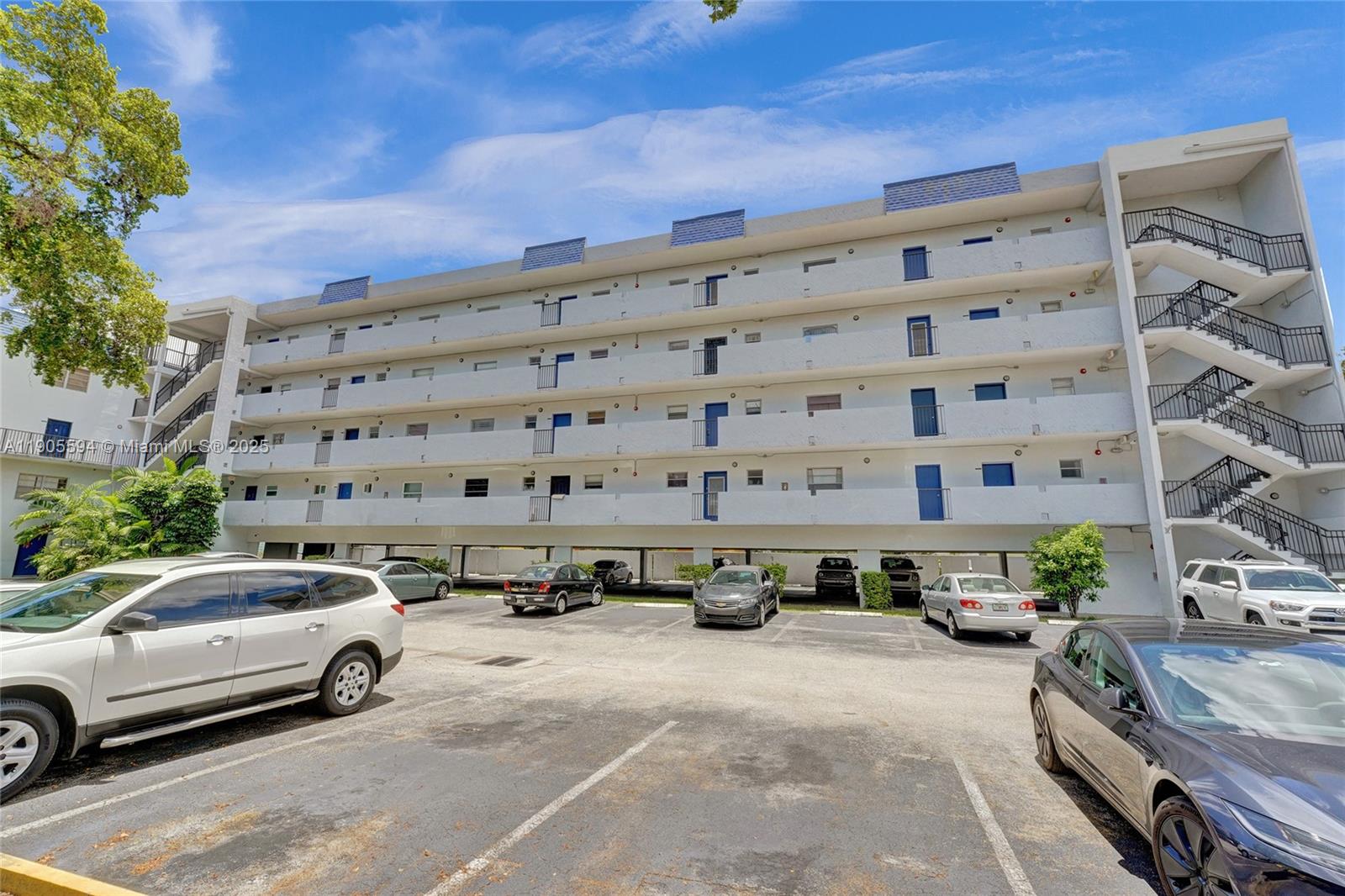 7541 Northwest 16th Street, Unit 1310 Plantation, FL 33313 - Photo 45 of 46 a view of building with parking area