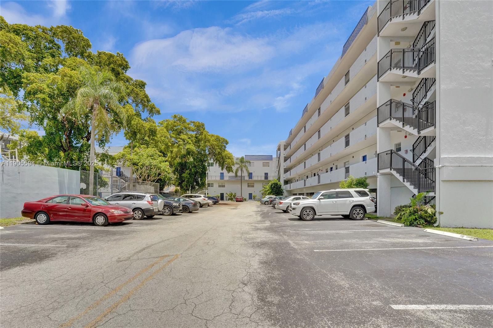 7541 Northwest 16th Street, Unit 1310 Plantation, FL 33313 - Photo 46 of 46 a view of a cars parked on the side of a street