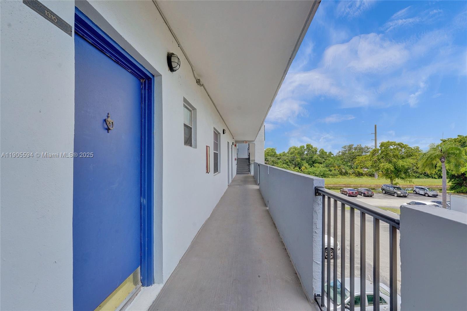 7541 Northwest 16th Street, Unit 1310 Plantation, FL 33313 - Photo 5 of 46 a view of a balcony with wooden floor
