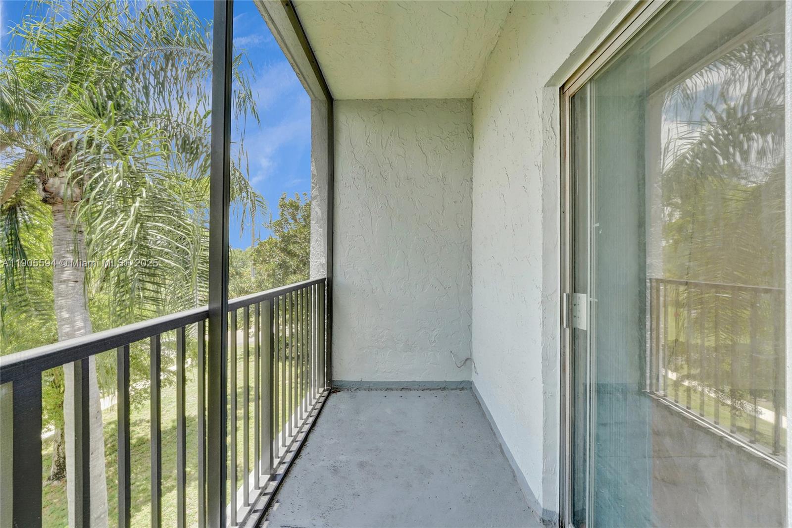 7541 Northwest 16th Street, Unit 1310 Plantation, FL 33313 - Photo 9 of 46 a view of a balcony with wooden floor