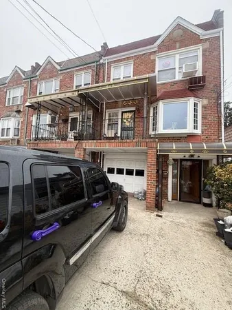 a view of a car park in front of house