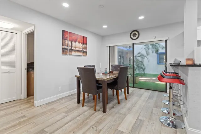 a kitchen with a table and chairs in it