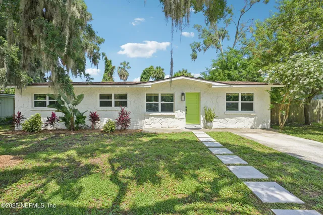 front view of a house with a yard