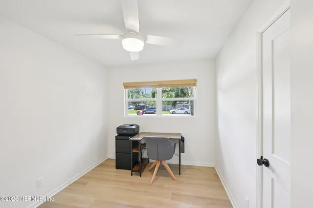 a workspace with furniture and a window