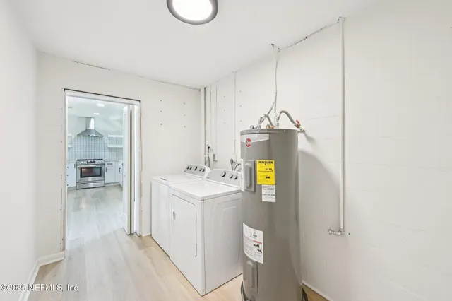 a room with a sink and a wooden floor