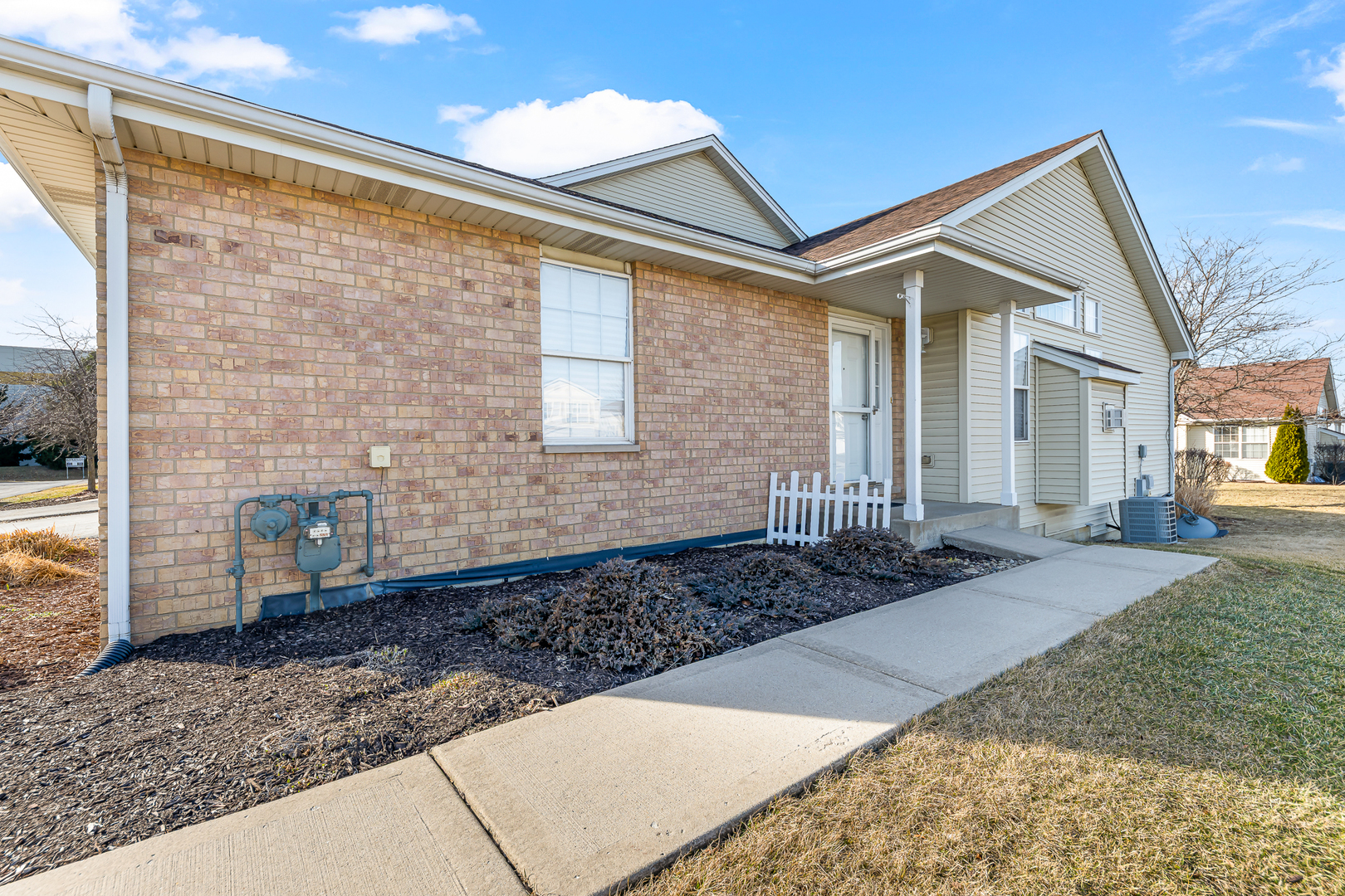 6006 West Carter Court Monee, IL 60449 - Photo 2 of 15 a front view of a house with yard