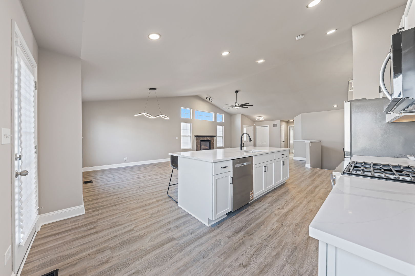 6006 West Carter Court Monee, IL 60449 - Photo 5 of 15 a large kitchen with a large counter top a sink stainless steel appliances and cabinets