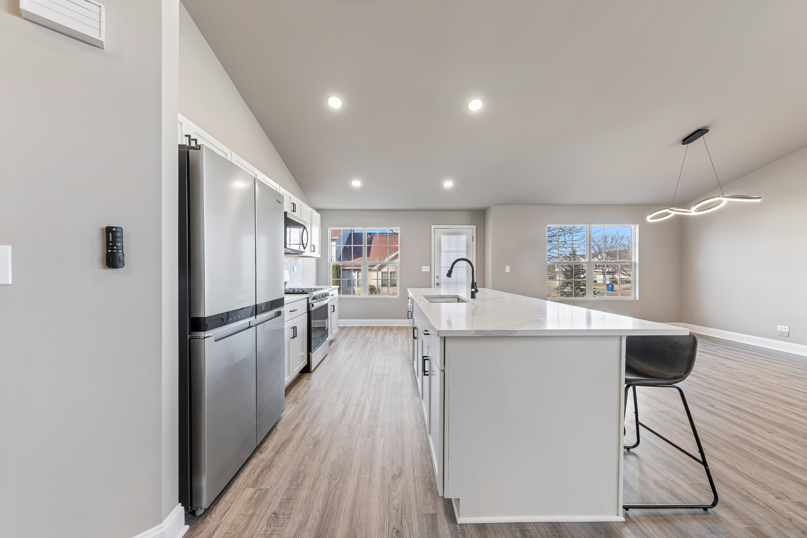 6006 West Carter Court Monee, IL 60449 - Photo 6 of 15 a kitchen with a refrigerator and a sink